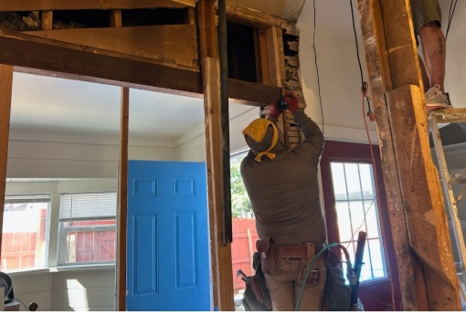 Vasquez Property Improvement carpenter working on exposed ceiling beams during a Fernley NV home renovation